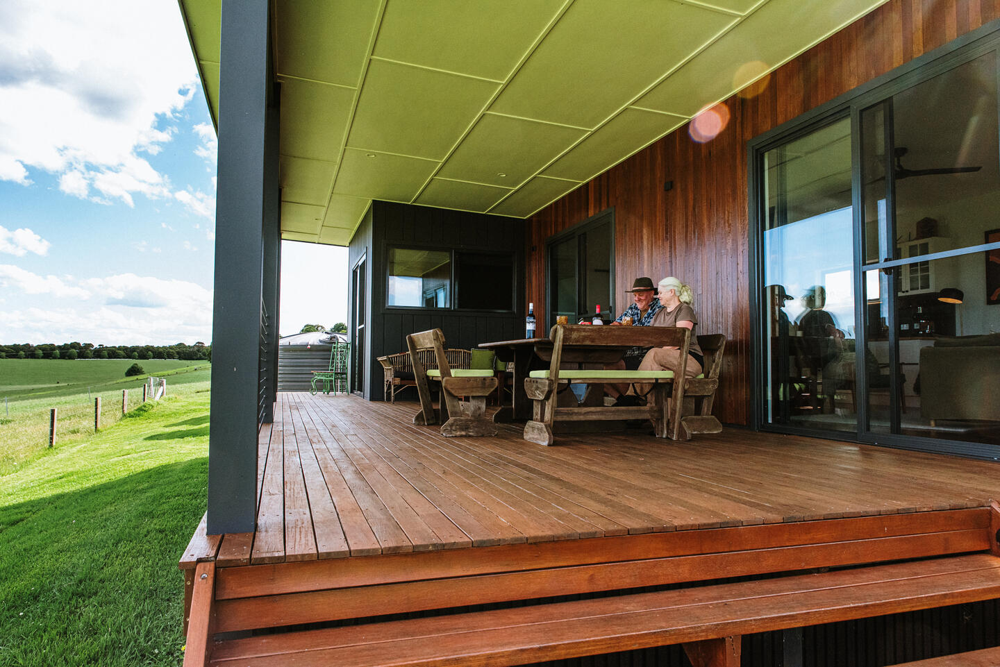 Deck overlooking farmland at Dorrigo Rainforest Retreat